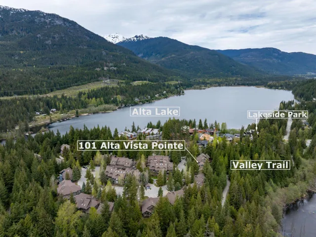 View of property location featuring a water and mountain view and a forest