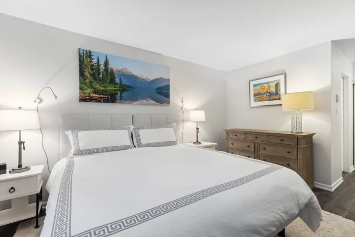Bedroom featuring wood finished floors and baseboards
