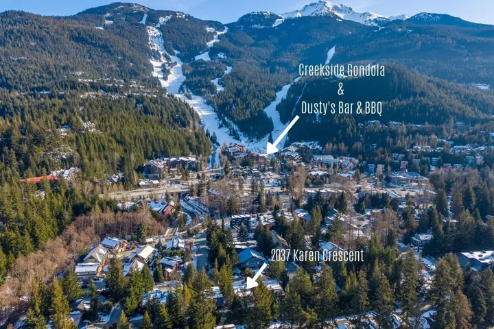 Aerial view of property's location with a mountainous background