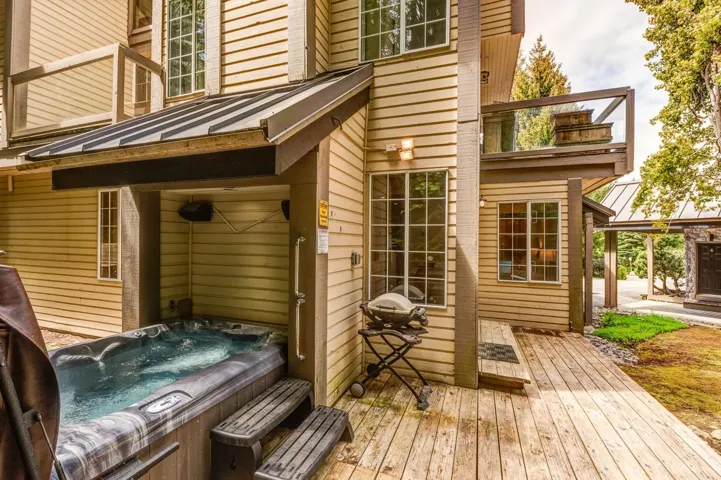 Wooden deck with a hot tub