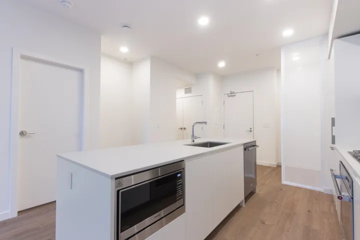 Italian kitchen by Inform features a gas cooktop, pull-out pantry, and integrated refrigerator