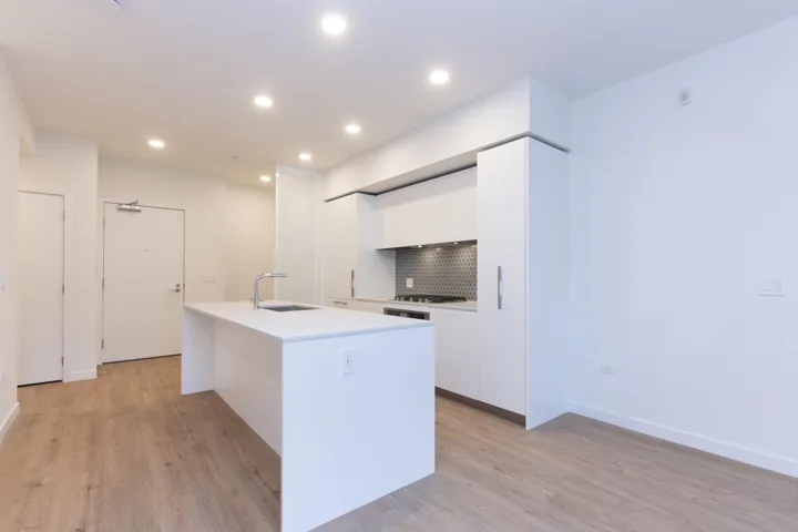 Italian kitchen by Inform features a gas cooktop, pull-out pantry, and integrated refrigerator