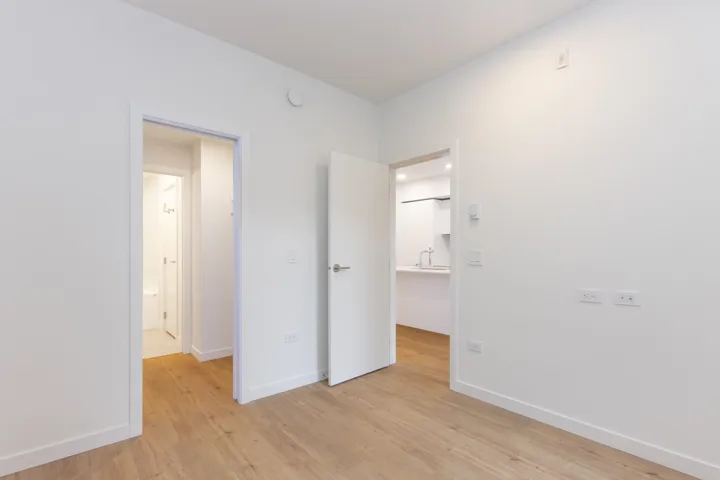 Bedroom with walk through closet into ensuite bathroom