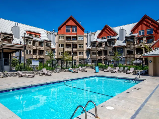 View of pool with fence and a patio