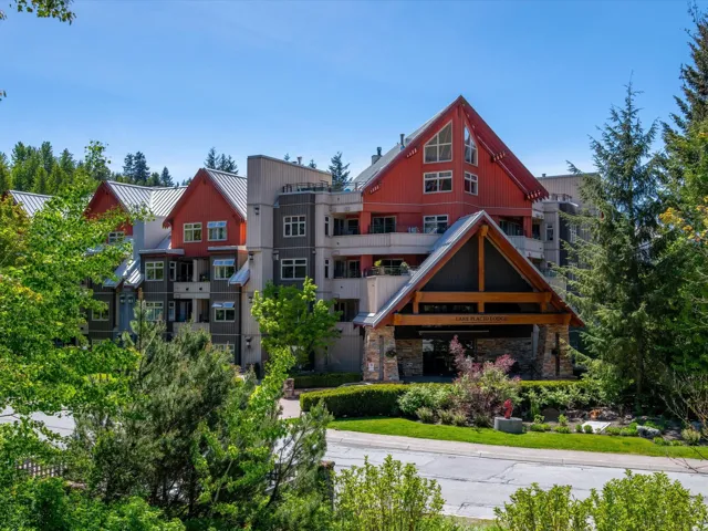 Exterior space featuring metal roof, a standing seam roof, and stone siding