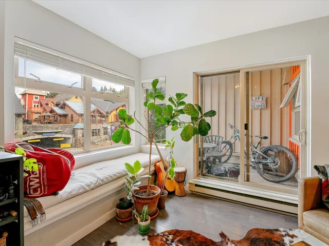Sitting room with a baseboard heating unit