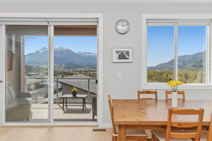 Dining room featuring a mountain view and light wood-type flooring