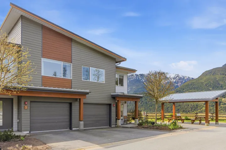 Contemporary home with a mountain view, a garage, and driveway