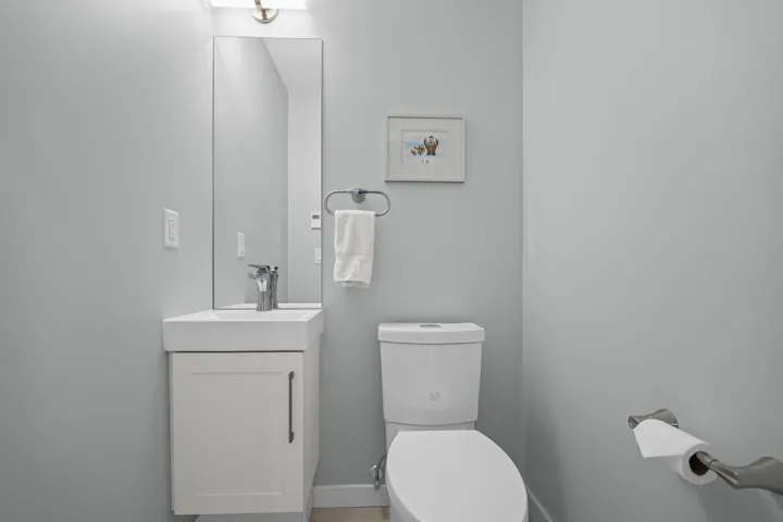 Half bath with vanity and toilet