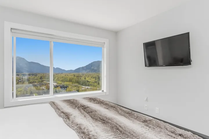Unfurnished bedroom featuring a mountain view