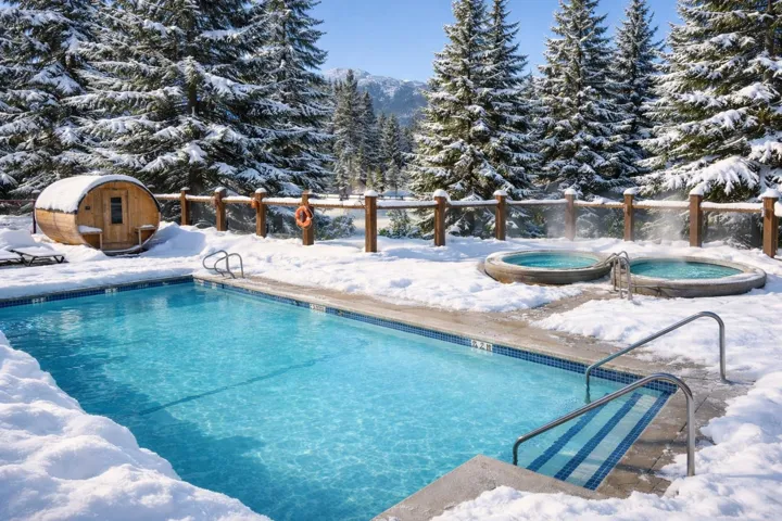 Snow covered pool with a community pool and a community hot tub