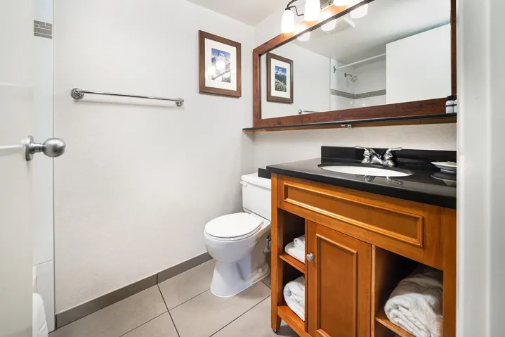 Full bathroom featuring vanity and light tile patterned floors