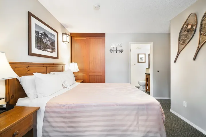 Bedroom featuring carpet and connected bathroom