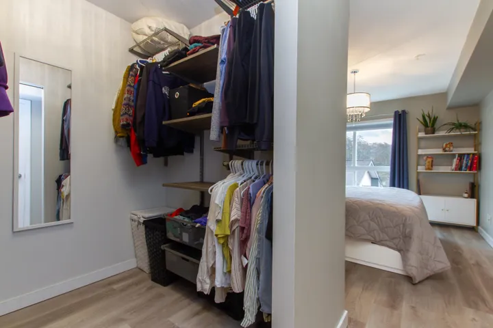 Walk in closet featuring wood finished floors