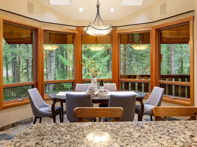 Dining room with stone tile floors and a skylight