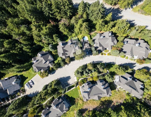 Aerial view of property's location featuring nearby suburban area