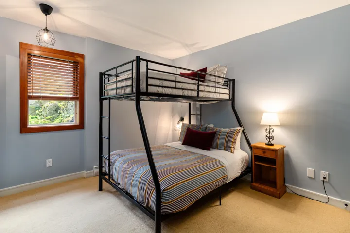 Carpeted bedroom featuring baseboards