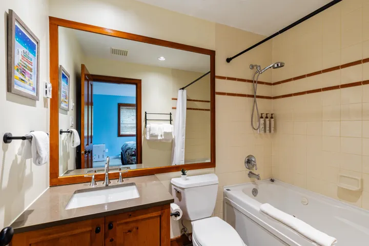 Full bathroom featuring shower / tub combo, connected bathroom, vanity, and recessed lighting