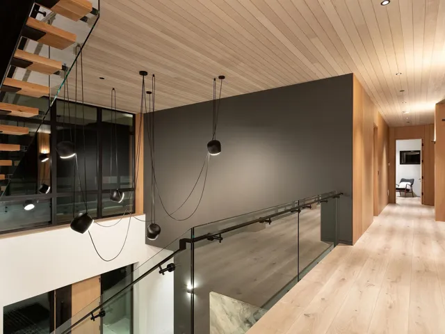 Hall with light wood-style floors and wooden ceiling