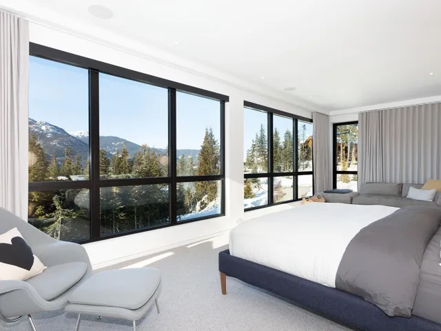 Bedroom with a mountain view, carpet flooring, and ornamental molding
