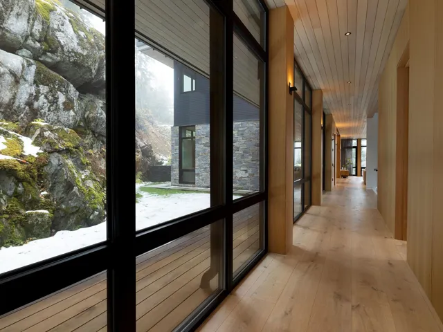 Hallway featuring light wood finished floors and recessed lighting