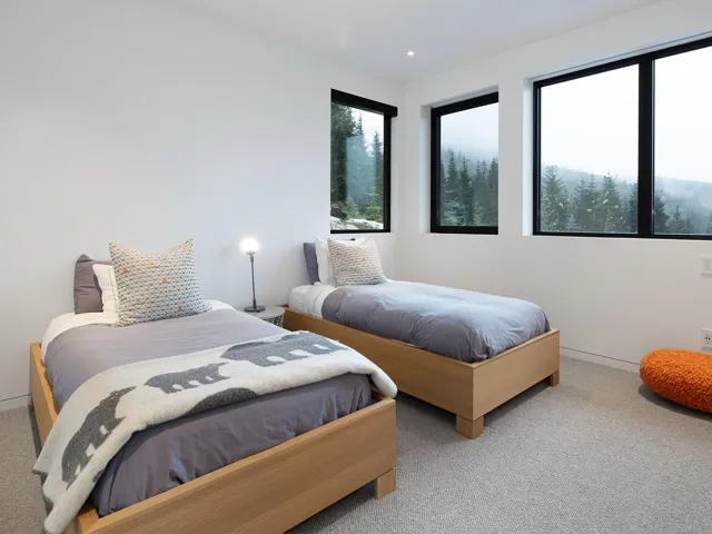 Carpeted bedroom featuring baseboards