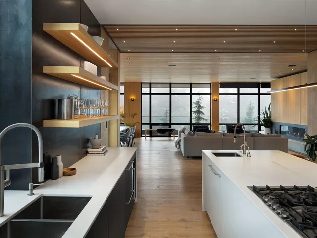 Kitchen featuring open shelves, floor to ceiling windows, modern cabinets, light stone counters, and stainless steel gas stovetop