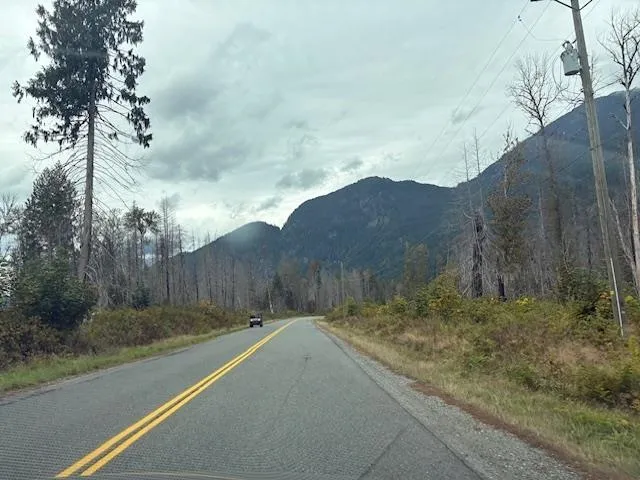 View of asphalt street with a mountain view