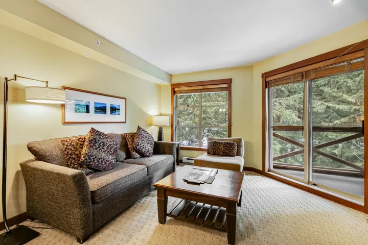 Living area featuring a baseboard radiator and baseboards