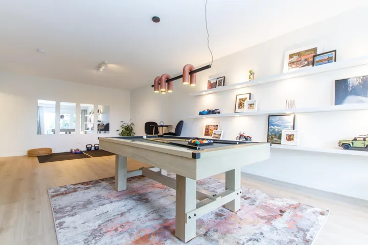 Game room featuring baseboards, billiards, wood finished floors, and rail lighting