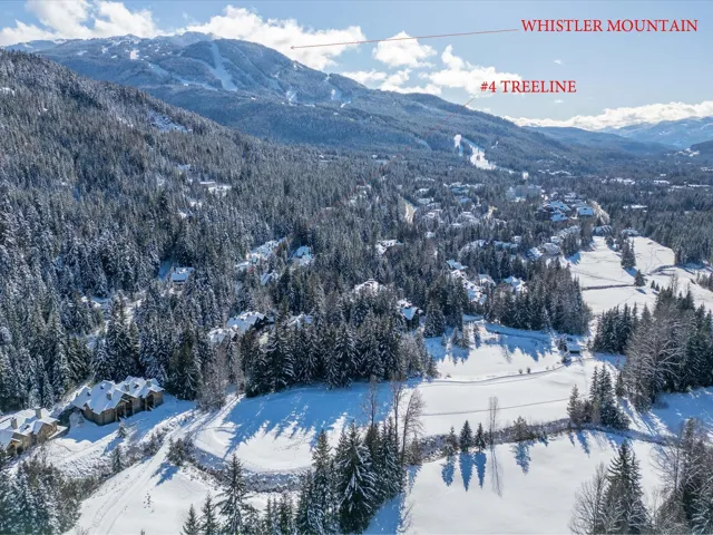 Snowy aerial view featuring a mountain view