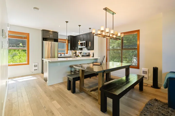 Dining space featuring light wood-type flooring, a chandelier, recessed lighting, and heating unit