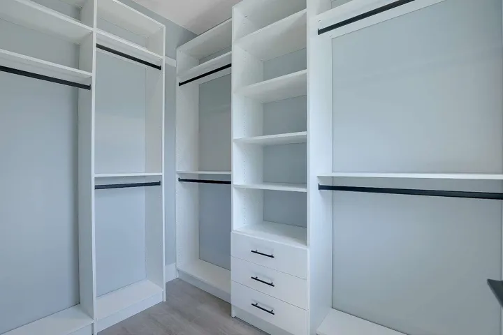 Spacious closet featuring light wood-type flooring