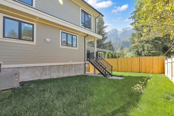 Fenced backyard with stairway and a mountain view