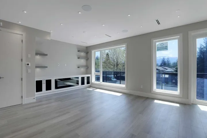 Unfurnished living room with light wood finished floors and recessed lighting