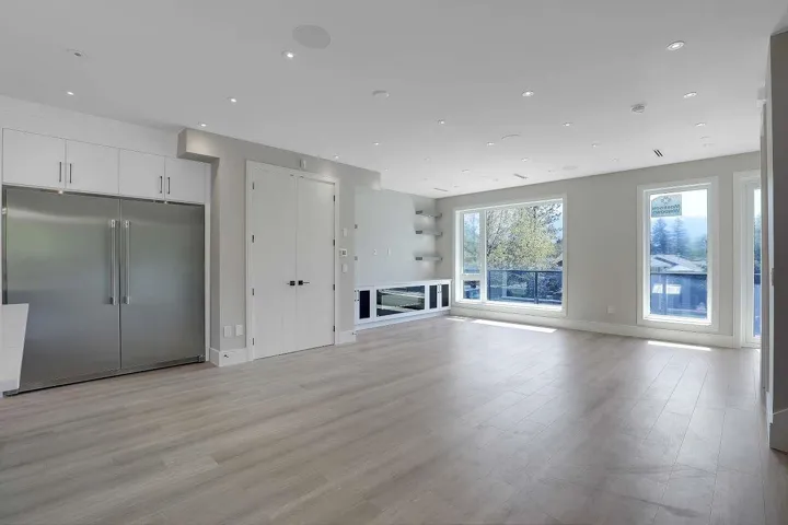Unfurnished living room with light wood finished floors and recessed lighting
