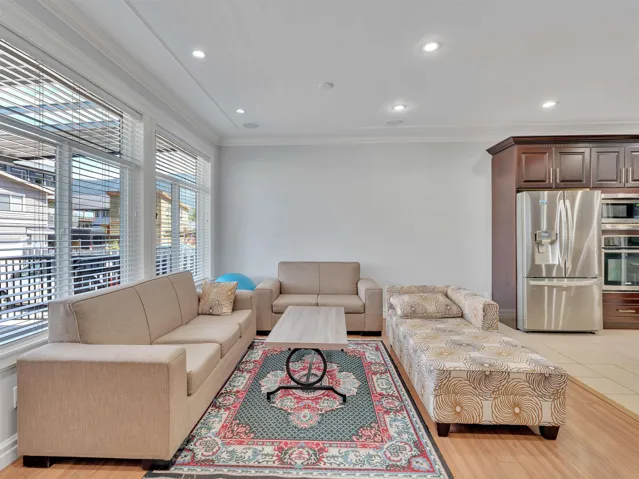 Open-concept living space with wood-finish flooring