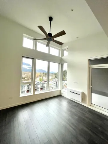 Unfurnished sunroom featuring a mountain view