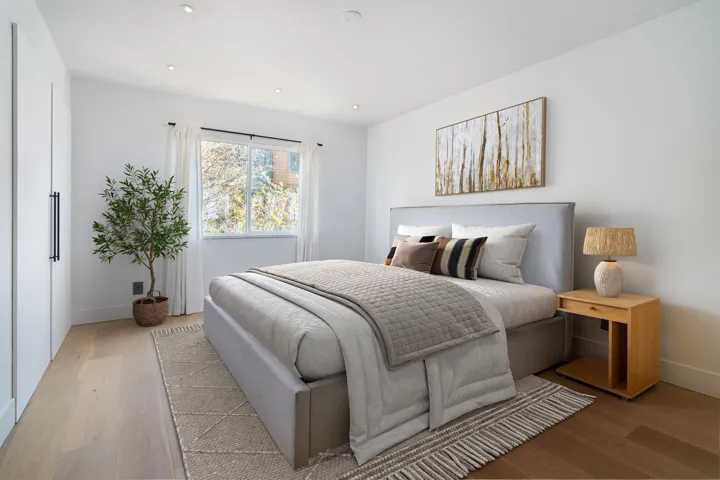 Bedroom featuring light wood-style flooring, baseboards, and recessed lighting