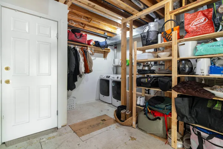 Unfinished basement with separate washer and dryer