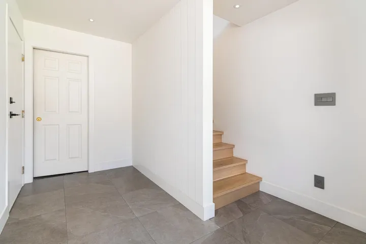 Stairway featuring recessed lighting and baseboards