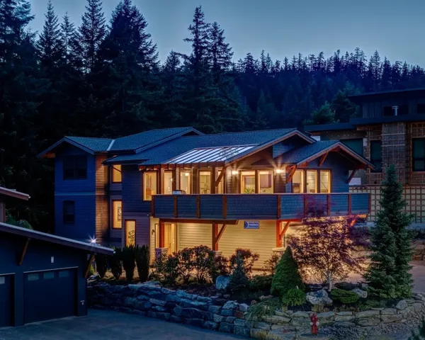 Contemporary home with a standing seam roof and a garage