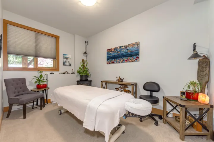Bedroom featuring light colored carpet and baseboards