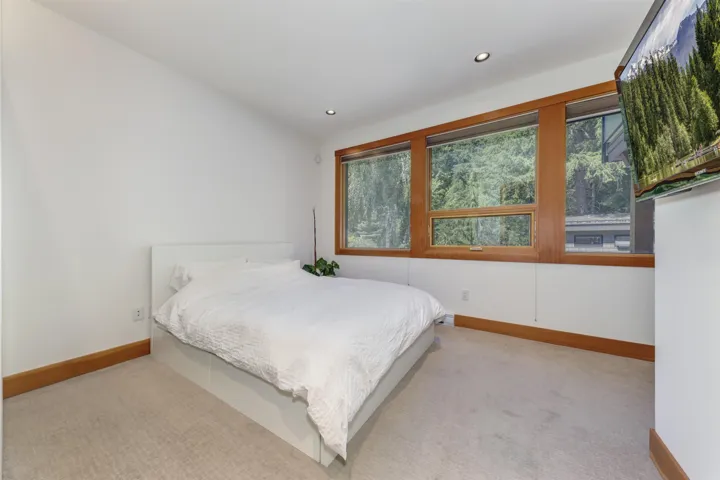 Carpeted bedroom featuring baseboards and recessed lighting