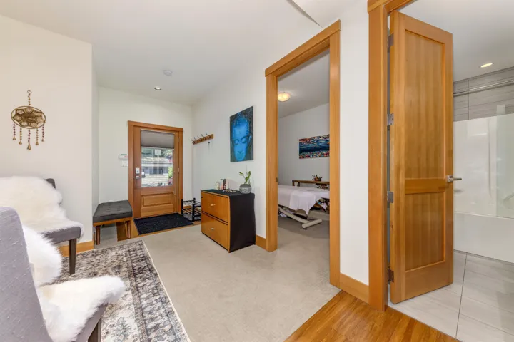 Foyer with baseboards and recessed lighting