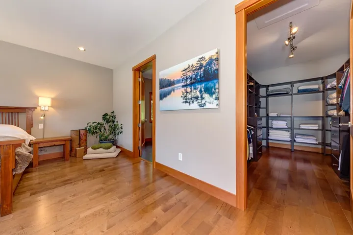 Hall featuring wood finished floors and baseboards