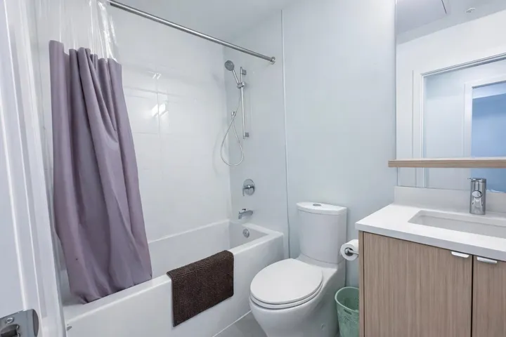 Full bathroom featuring vanity and shower / bath combo with shower curtain