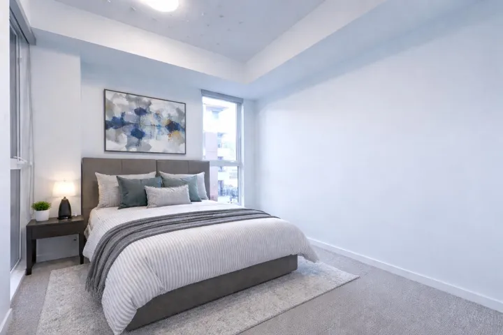 Bedroom featuring carpet floors and baseboards