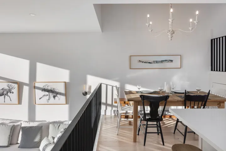 Dining area with light wood-style flooring and a chandelier