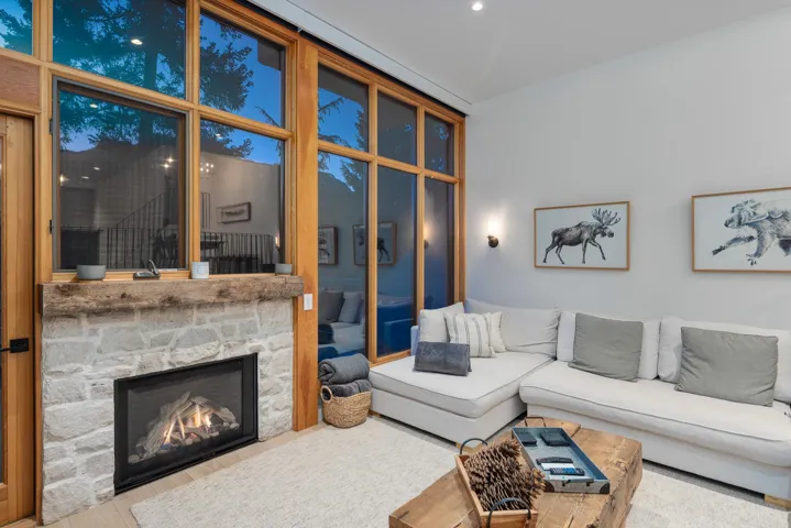 Living room with a stone fireplace